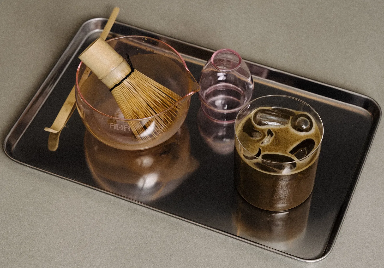 Ada Studio matcha and glassware range arranged on a metal tray